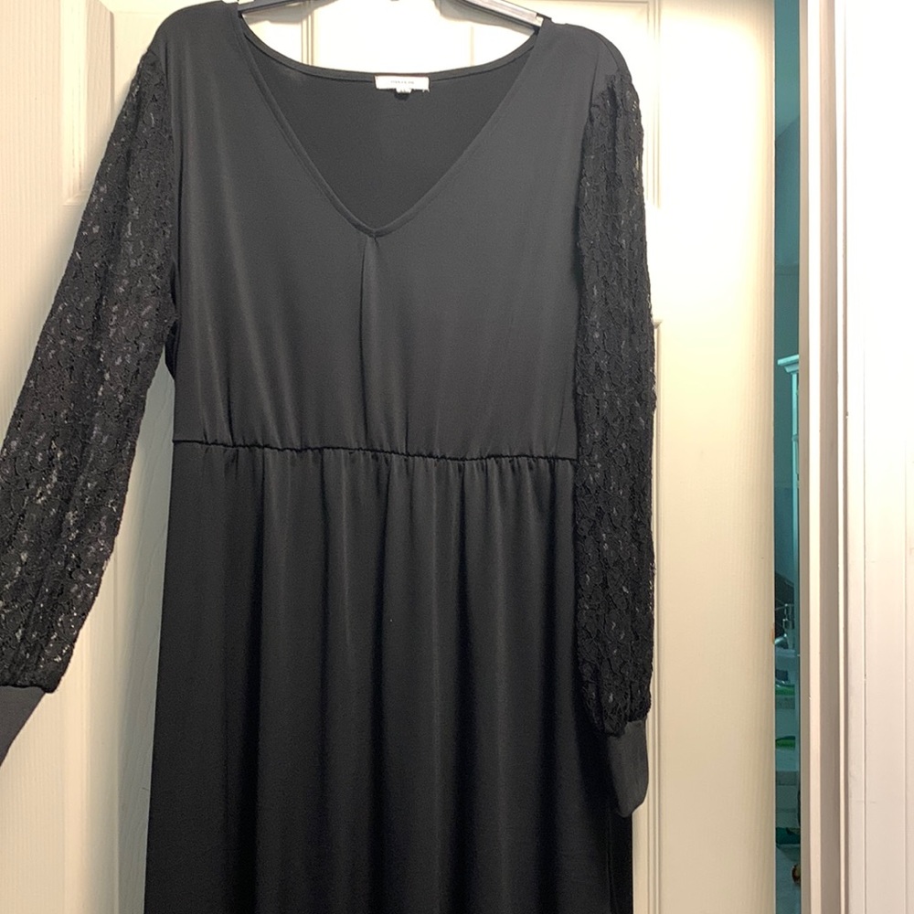 Little black dress, perfect for a cold night. Lace sleeves and cinched waist.